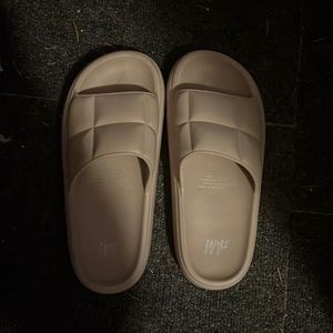 Beige H and M slides